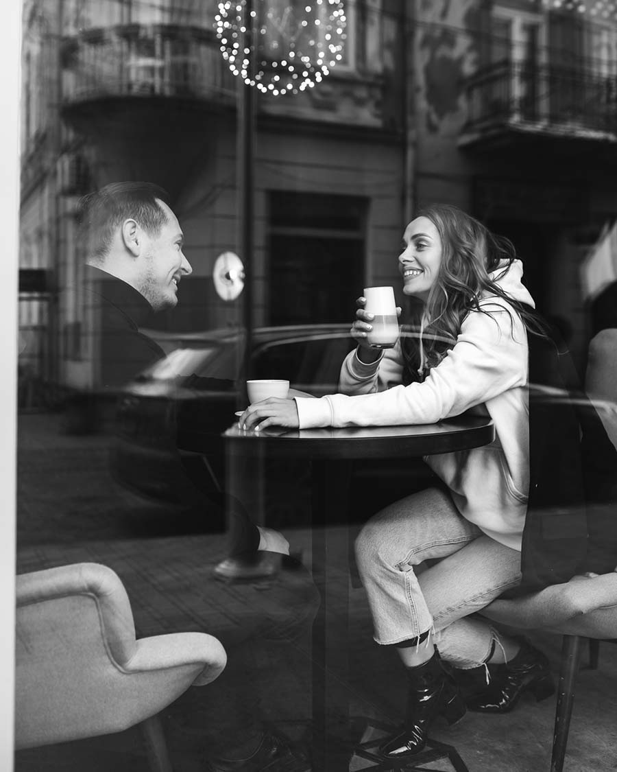 Two well dressed adults enjoying a relaxed date near Auckland harbour